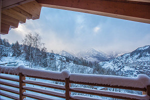 View from terrace of snow covered mountians